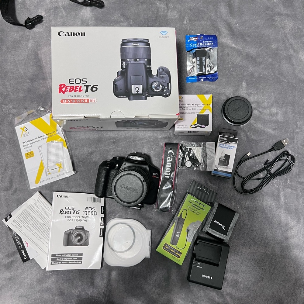 Canon Camera and a full kit with a bag and two additional lenses